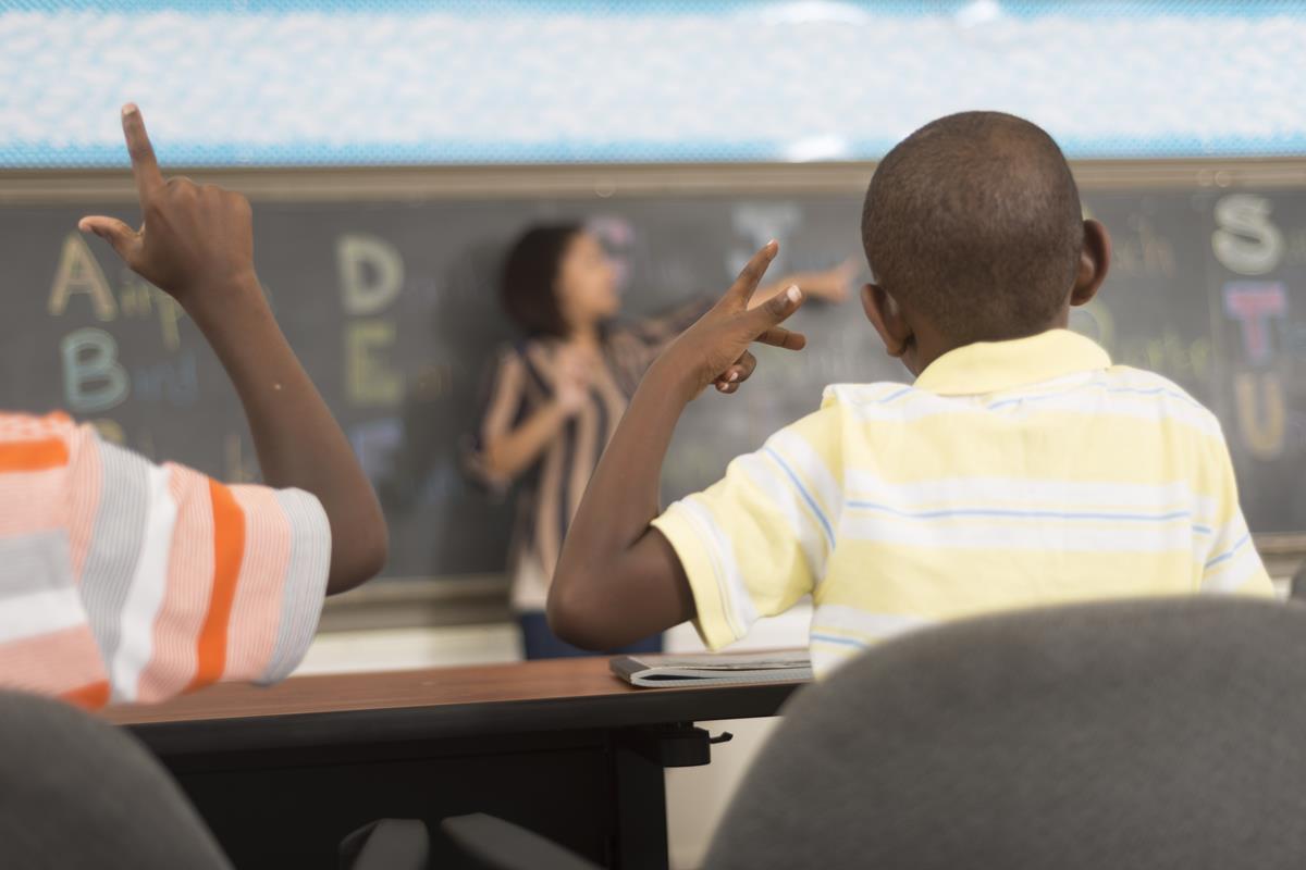 Students using sign language in the classroom