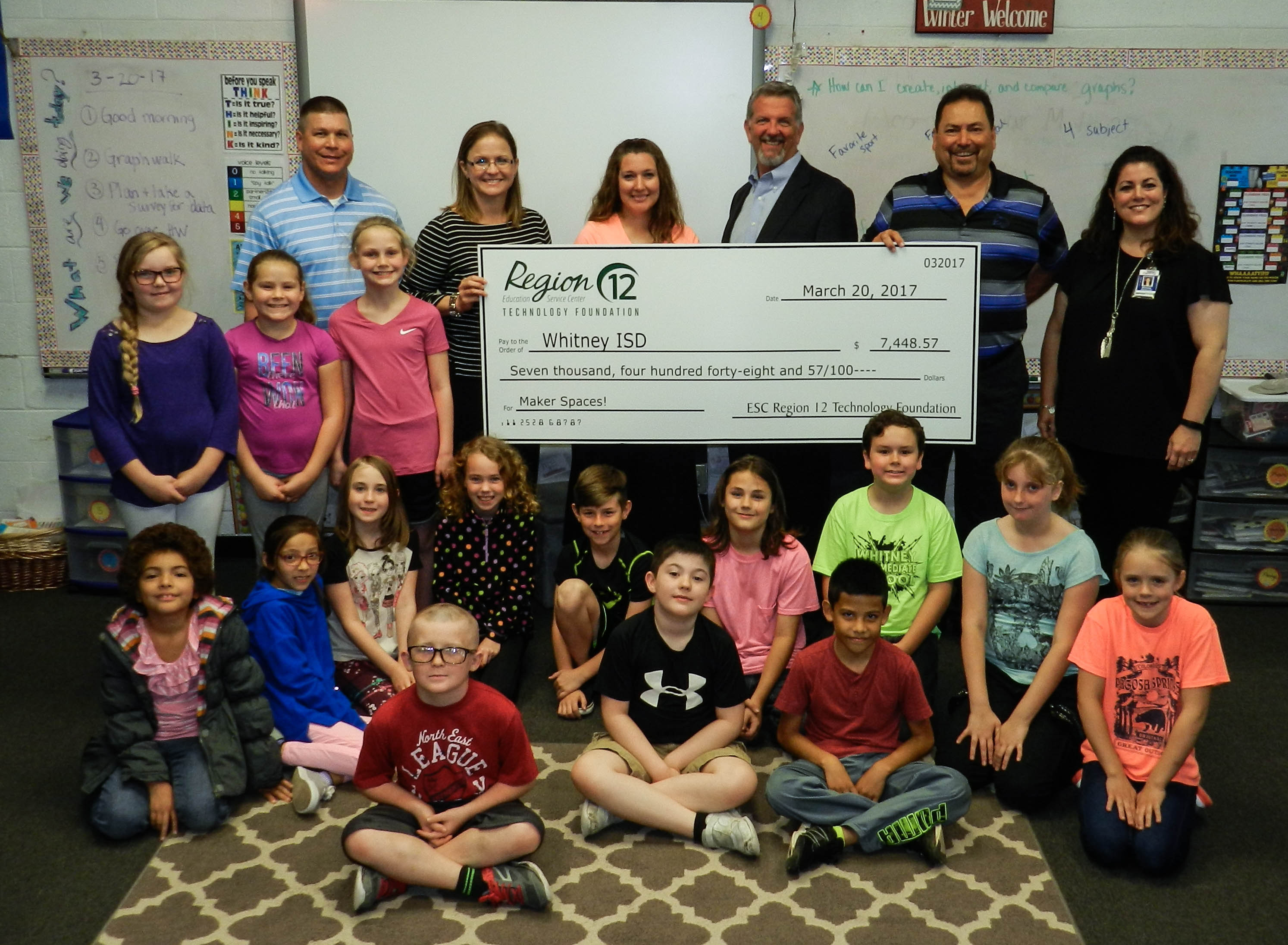 students of Whitney ISD pose with a large check they earned from the Technology Foundation