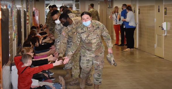 Copperas Cove ISD military high fives for students in hallway